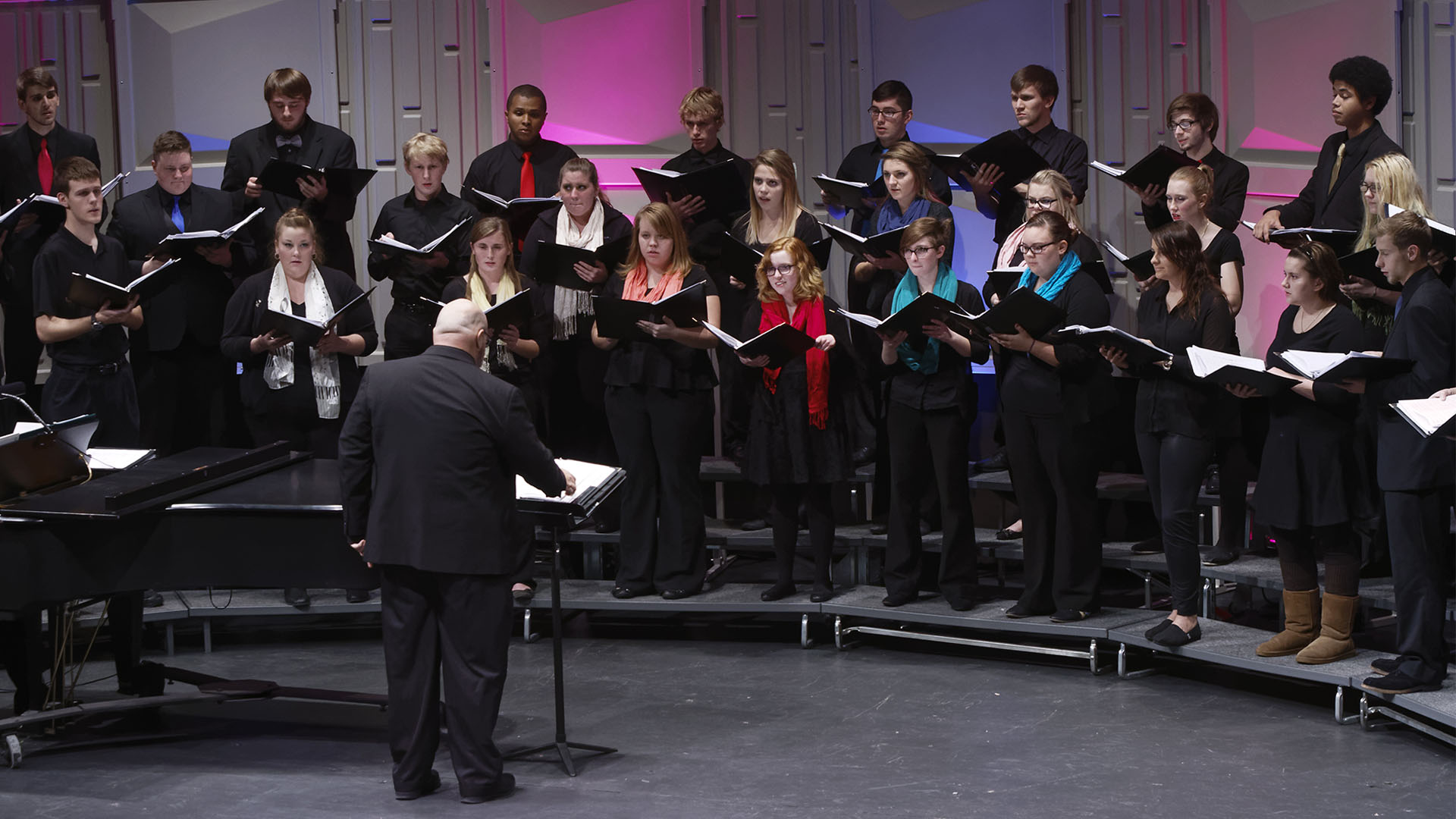 Choir performance in the Theatre of the Dale A. Lyons Building
