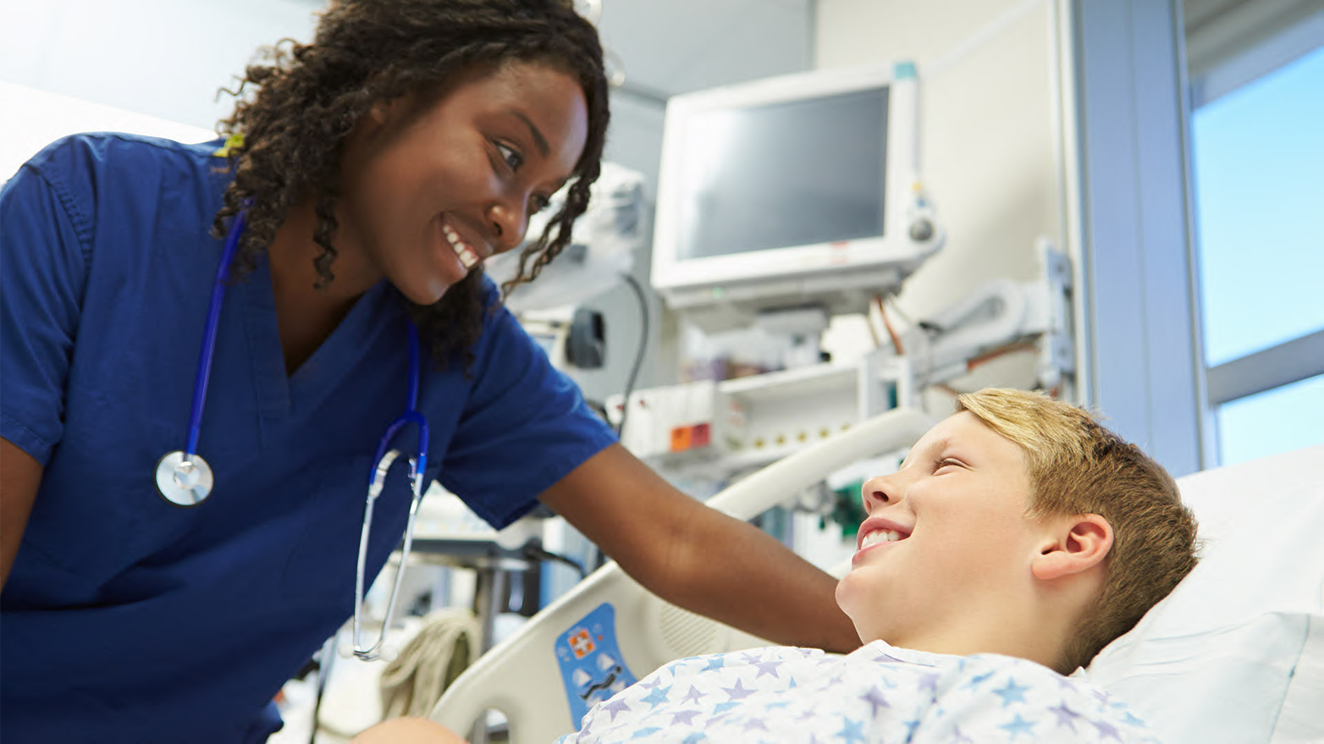 Young ER nurse with young patient