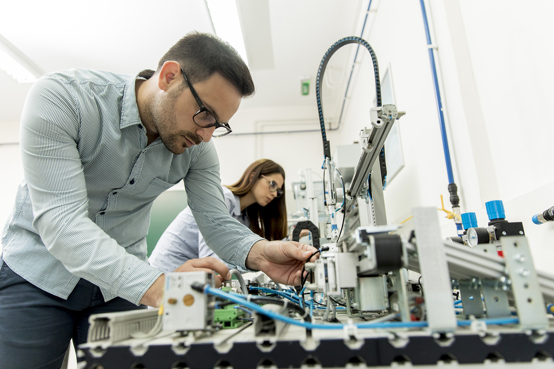 Engineer working on robotic components