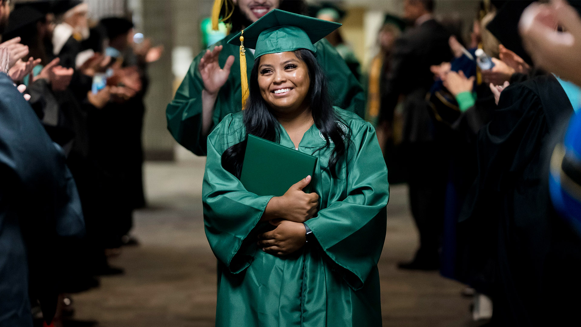 Graduate with diploma