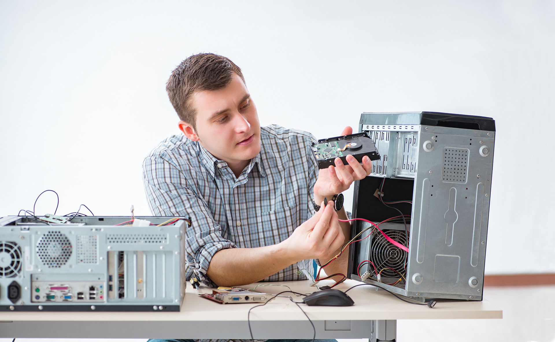 IT Administrator repairing computer