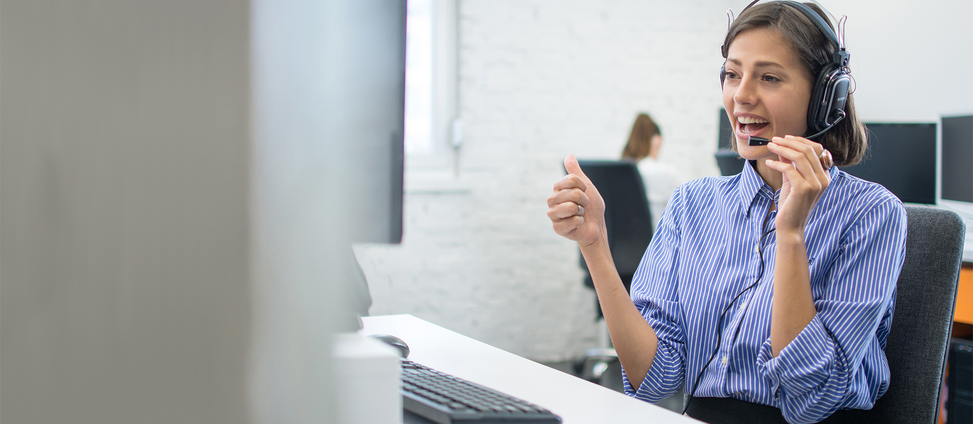 IT Help Desk Staff Member Helping Customer