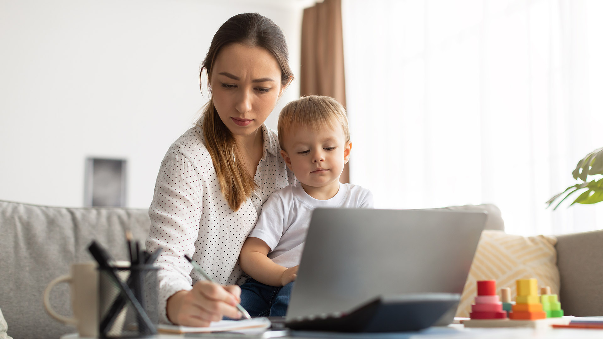 Young mother taking advantage of online learning with SMC.