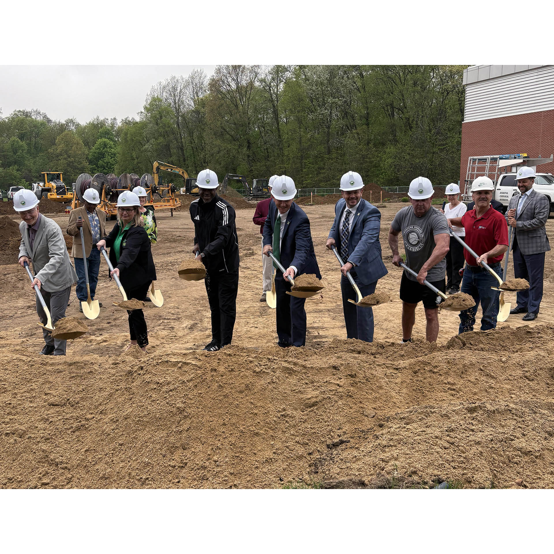 Back row steps forward for their turn at the gold shovels