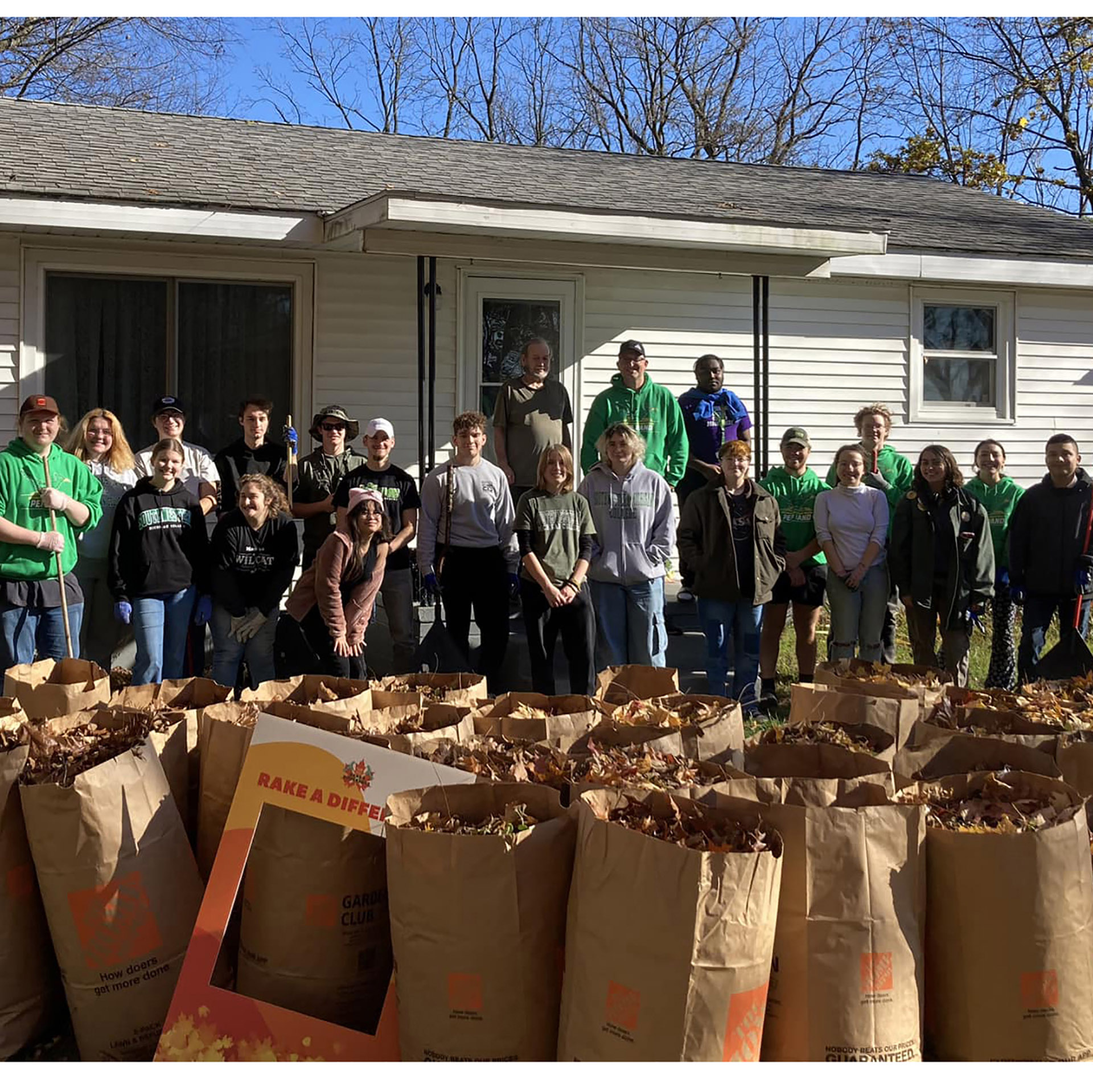 Band members raked a Vietnam vet's yard for Veterans Day