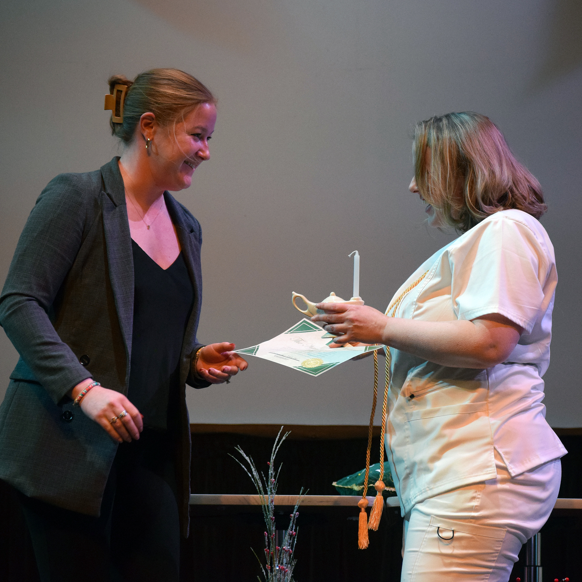 Haley Smith congratulates Sara Greenway, one of three Nightingale Award winners