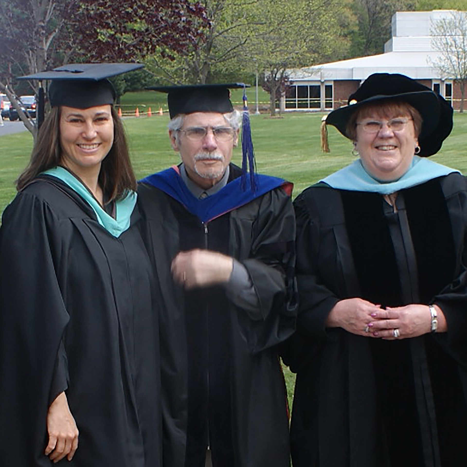 Dr. Steve Jess between Christi Young and Dr. Mary Young-Marcks