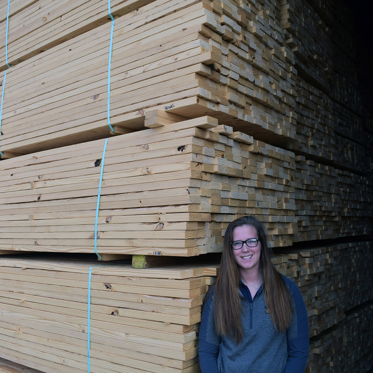 Shawnee poses beneath the raw inventory which is usually in motion