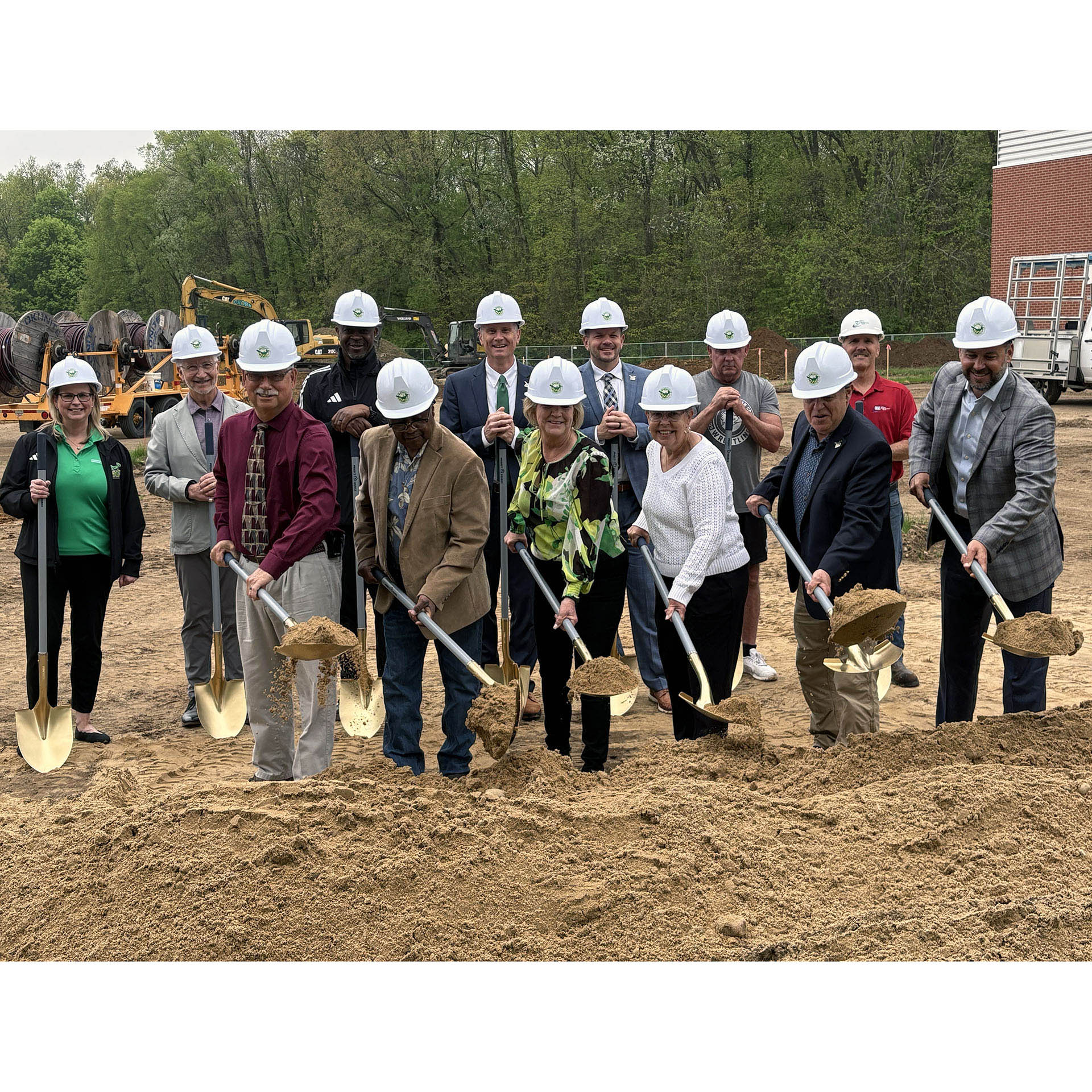 SMC trustees turn over ceremonial dirt at the wrestling groundbreaking